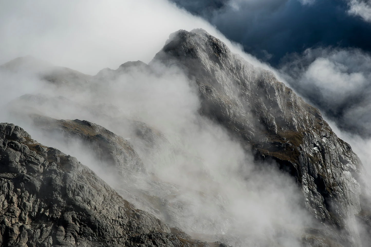 Mist rising from mountain top